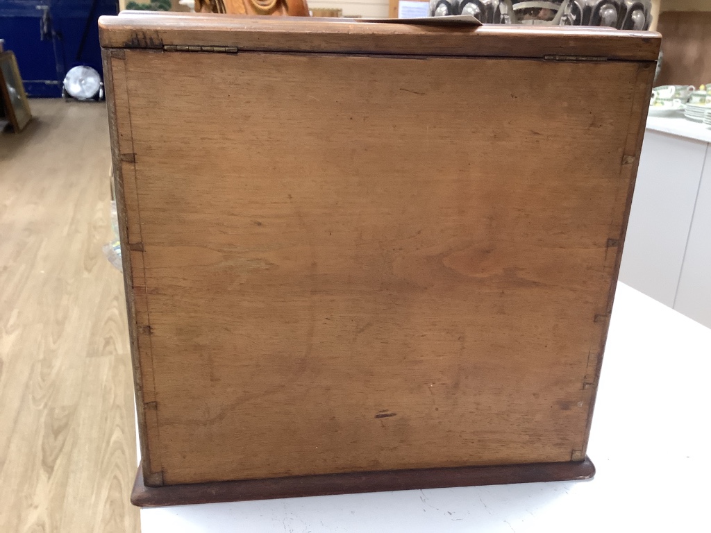 A Victorian walnut stationery box with fitted interior, height 31cm